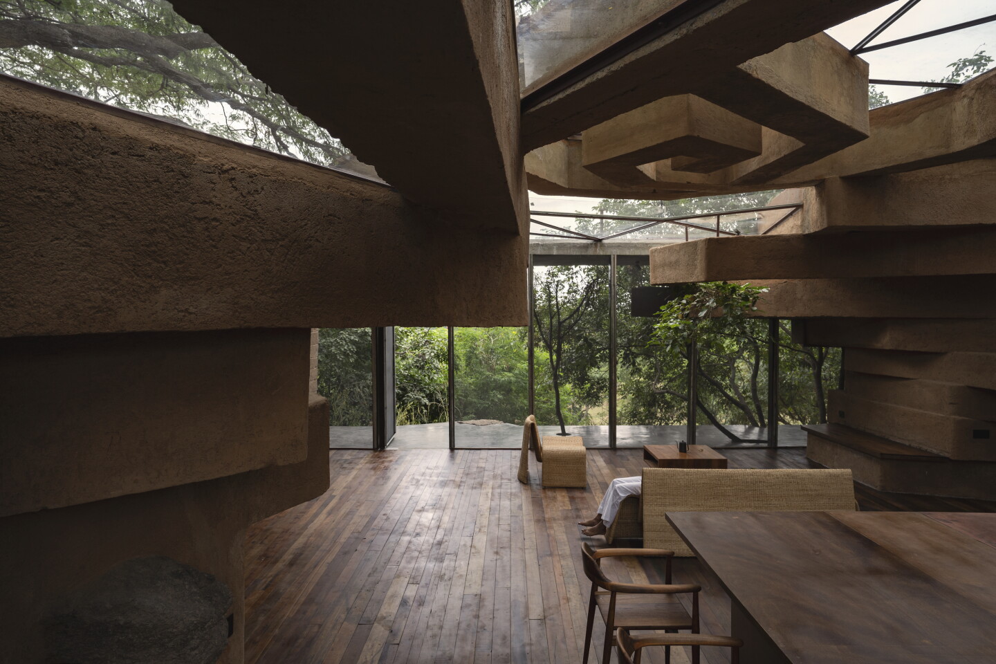 Chuzhi opens onto a verandah area shaded by surrounding trees.