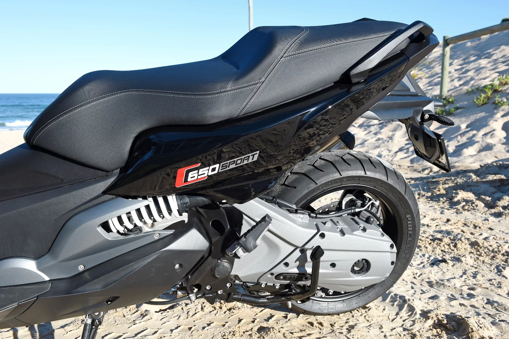 BMW's C650 Sport and GT: horizontal shock is preload-adjustable. Bumping it up to maximum preload accounted perfectly for my weight and gave it superb ground clearance