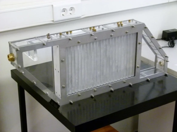 The prototype device utilizes paraffin contained within thin aluminum plates