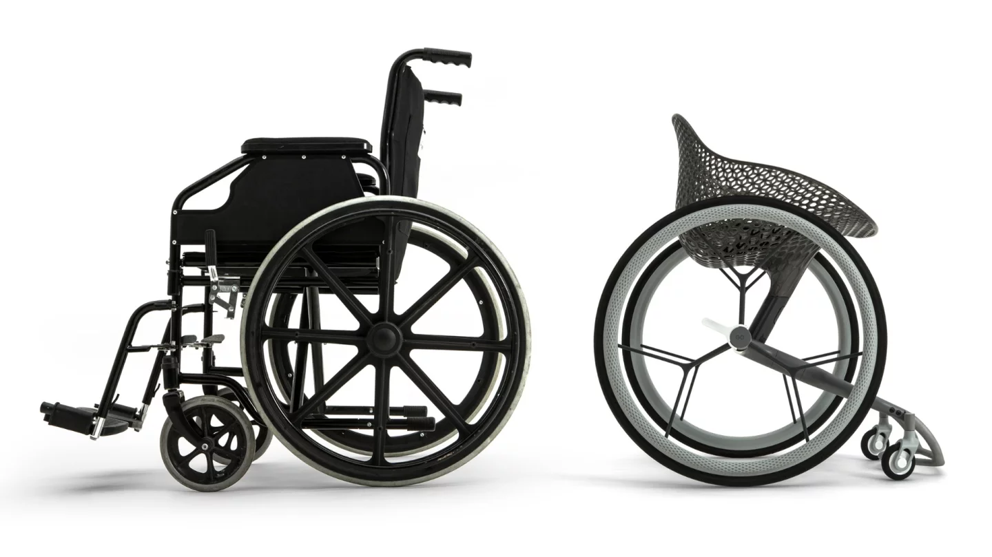 The design of the 3D-printed chair looks slick next to a more standard wheelchair