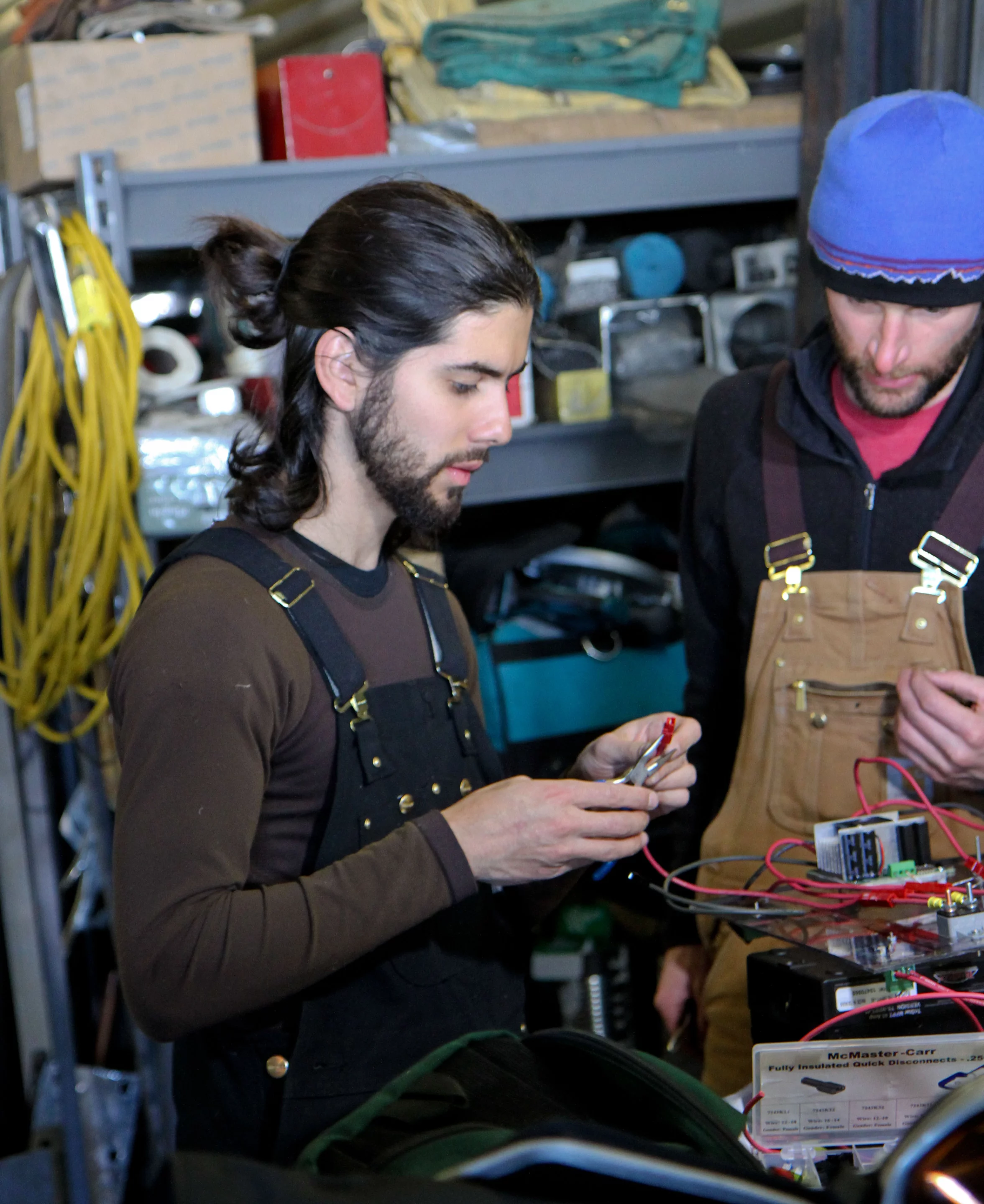 Gabriel Trisca (left) and Mark Robertson, graduate students at Boise State University, repair connectors on the motor controller for GROVER (Photo: NASA Goddard/Matt Radcliff)