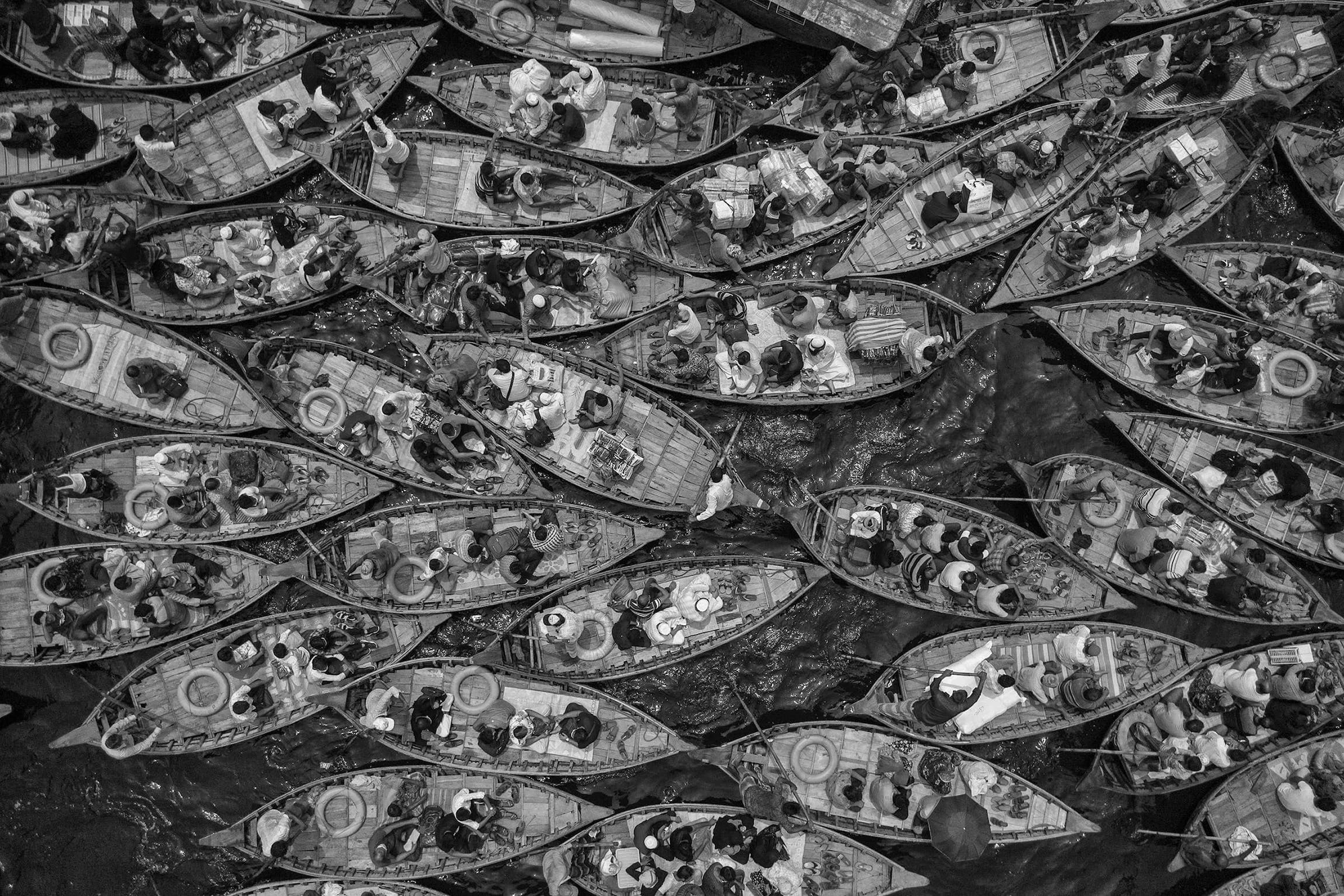 "Boats Filled with Travelers," second winner of the Streets category of the 2023 Black and White Photo Awards