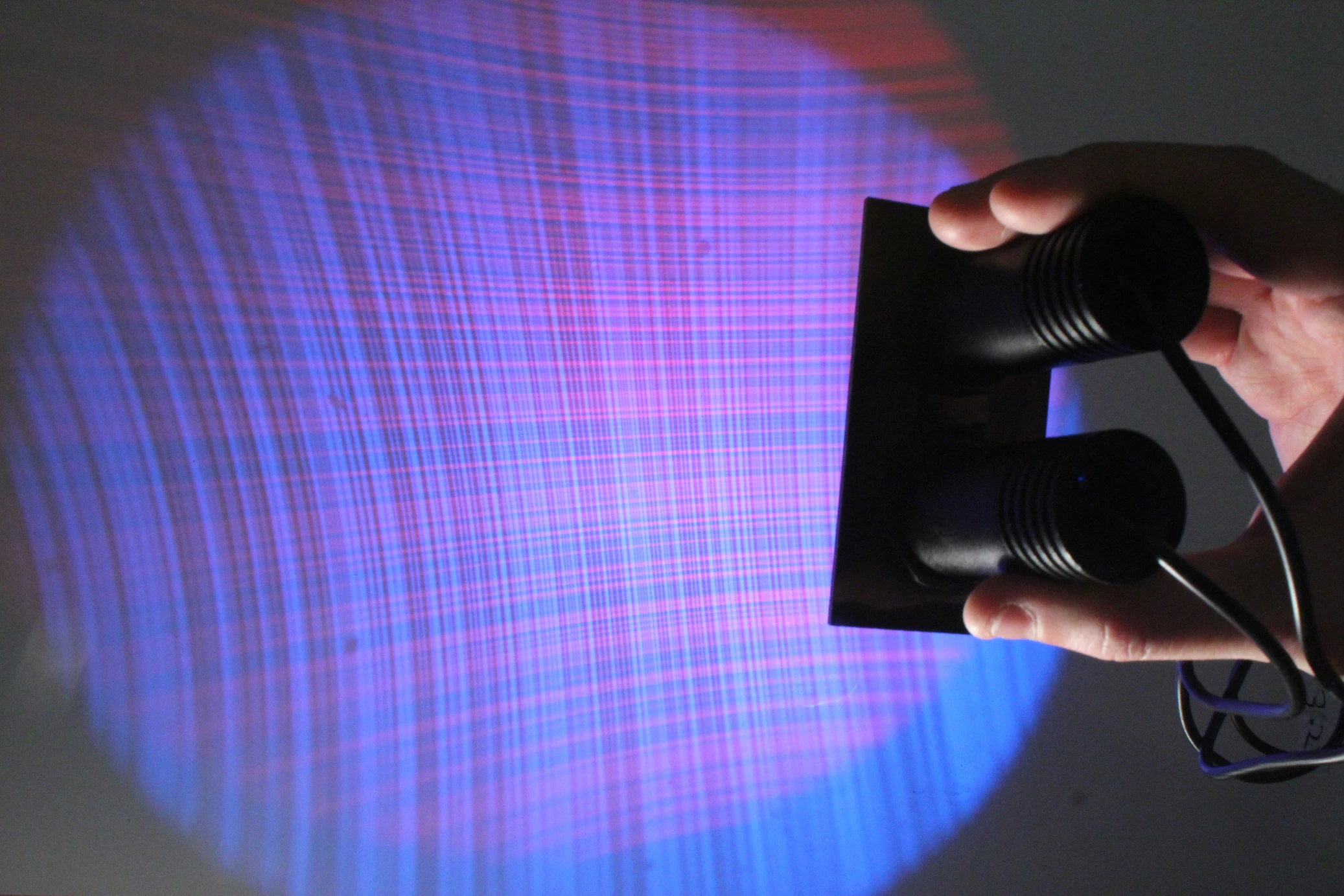 Two inexpensive pico projectors are used to project the vertical and horizontal m-sequences