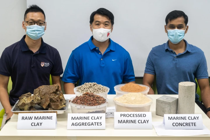 Researchers from the National University of Singapore' Centre for Advanced Materials with samples of their eco-friendly concrete that incorporates waste clay