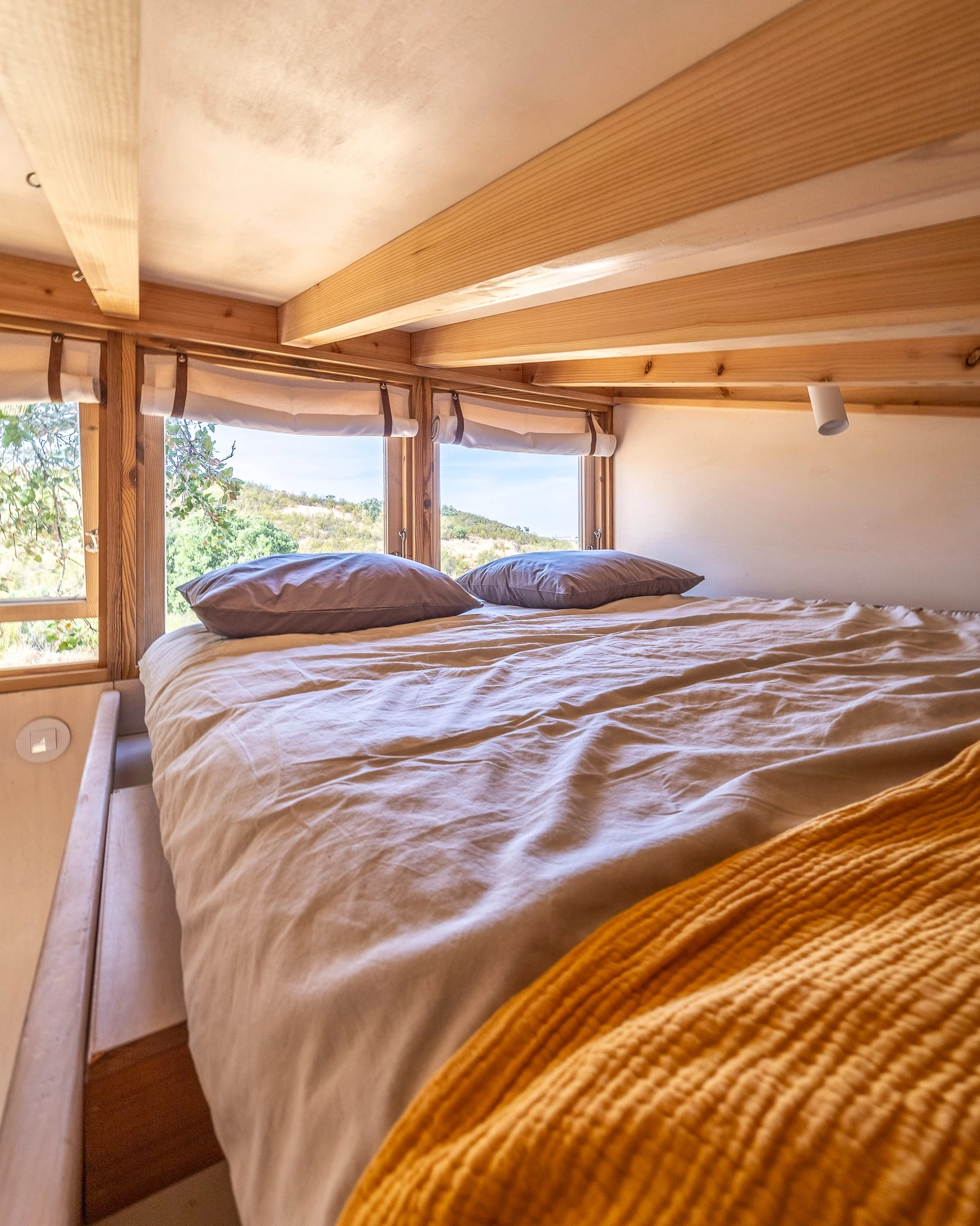 The Terra m3_Tiny House's bedroom is a typical tiny house-style space with a low ceiling
