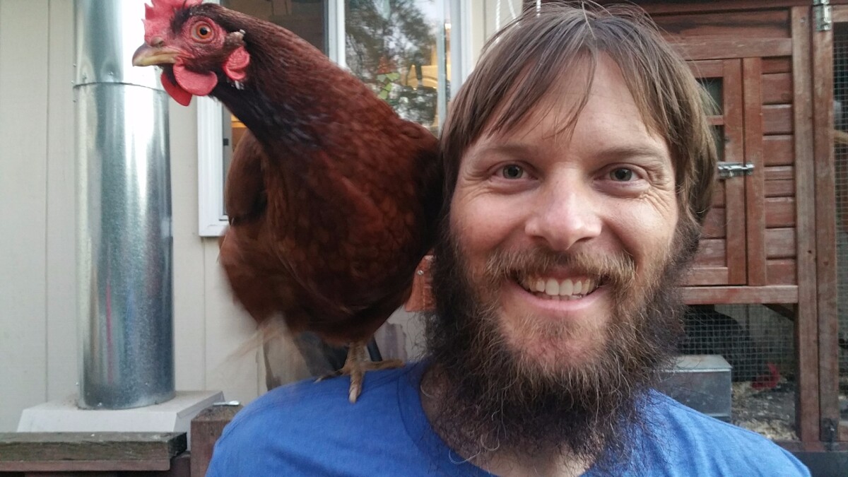 Luke Workman, right, with chicken.