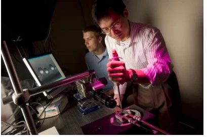 Duke University researchers Jonathan Boreyko, left, and Chuan-Hua Chen study the properties of lotus leaves (Photo: Duke University)