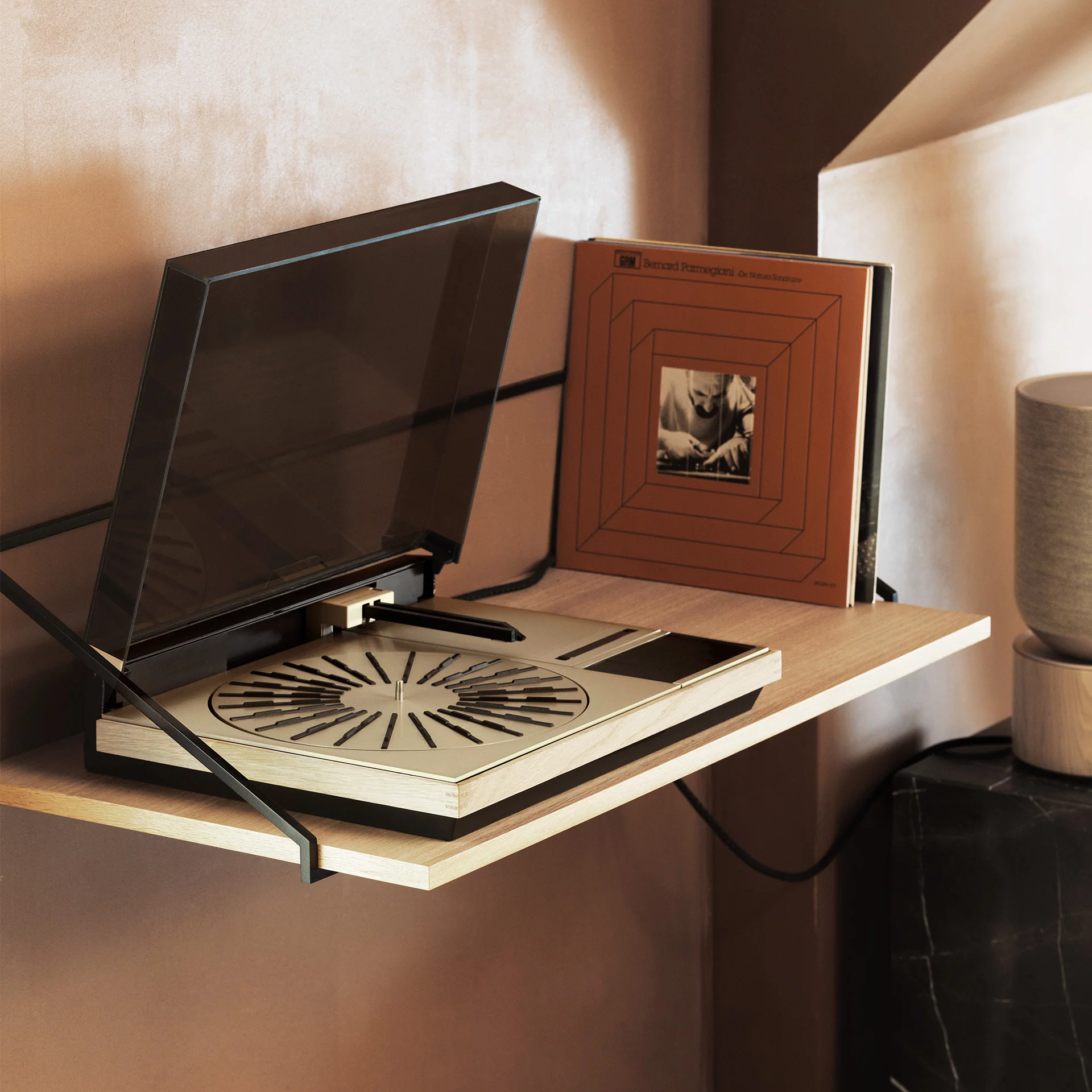 The Beogram 4000c turntable is housed in a hand-crafted oak frame, and its aluminum surfaces have been treated to a splash of color