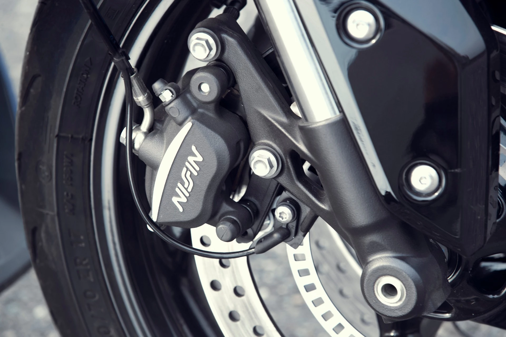 Stopping power for the 2022 Triumph Tiger Sport 660 is provided by a pair of two-pot Nissin calipers
