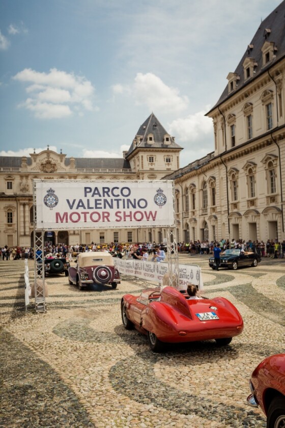 The thirty cars entered in the Parco Valentino Classic enter the Piazza Vittorio Veneto for judging