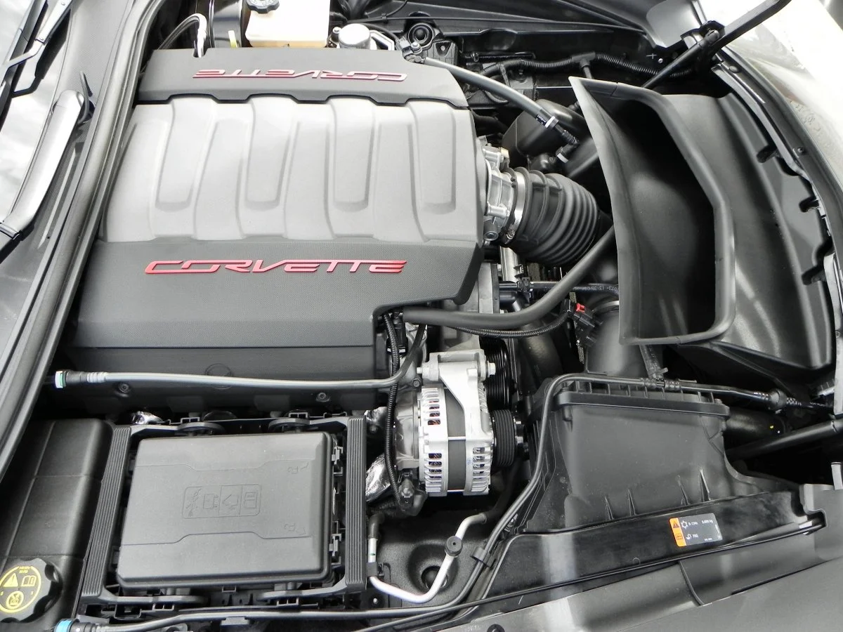 The heavy cant of the radiator allows air to be pulled in from underneath the car, much of which vents through the top of the hood