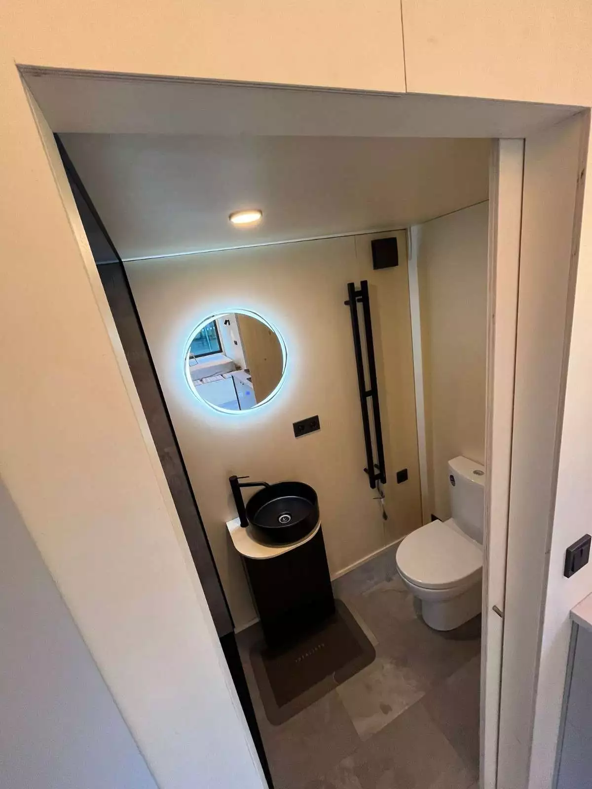The BTH Single's bathroom includes a flushing toilet, a small sink, and a shower