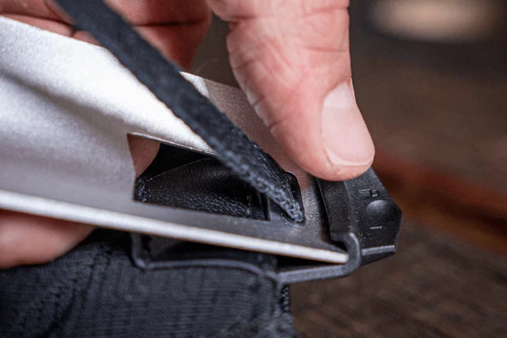 A button at one end of the seat makes it easier to remove from the wings