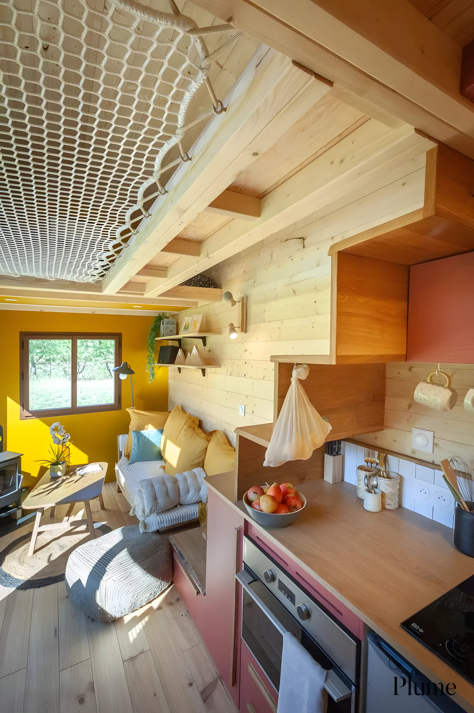 The Cosmos' living room includes a sofa and a coffee table, plus a wood-burning stove for warmth