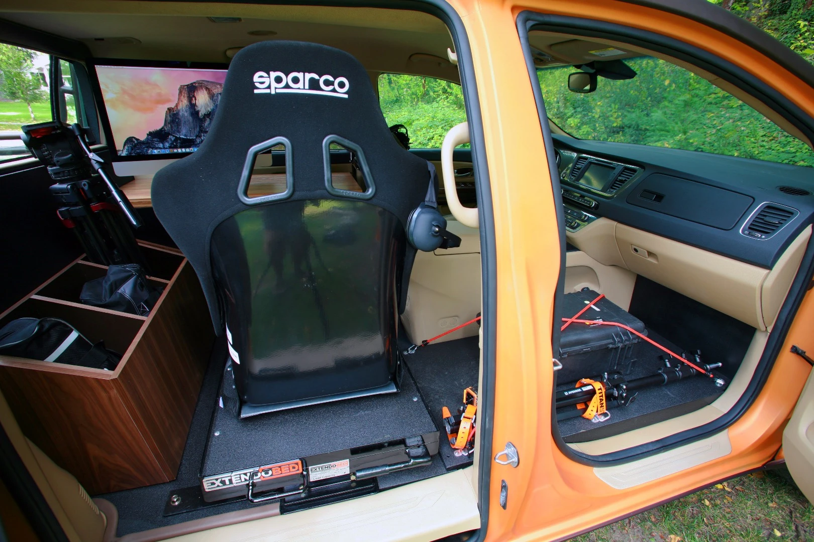 Inside, the rear passenger seat serves as part of the work station
