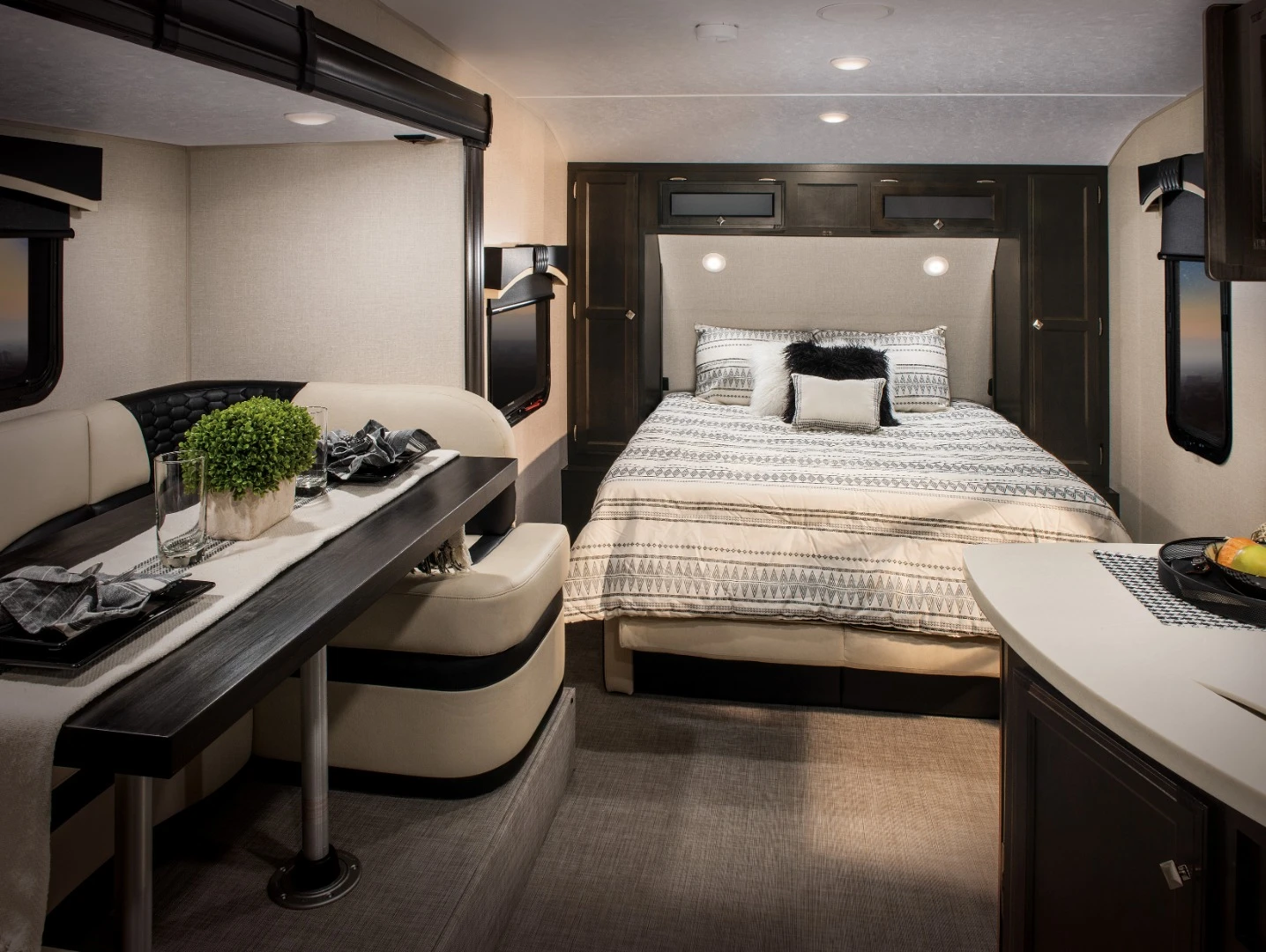 The Sonic X interior includes a front-end Murphy bed that folds over top the loveseat