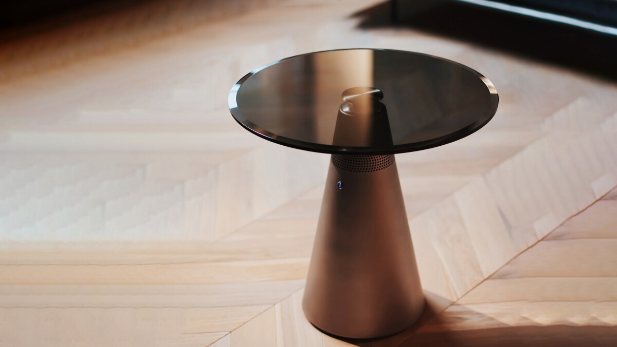 The Standesk's aluminum pedestal is topped by a tempered glass table top