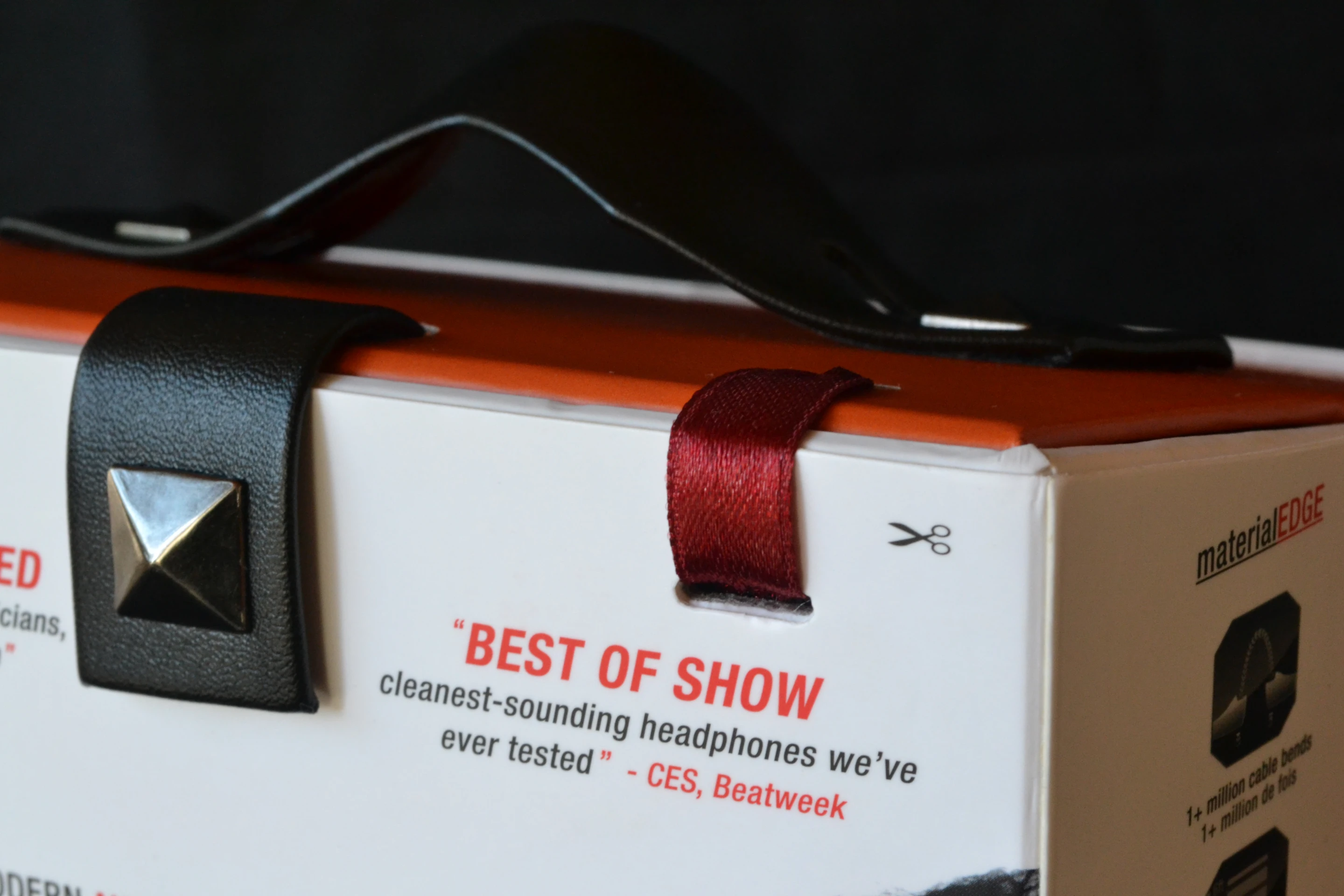 Like the grand opening of some important building, you have to cut the ribbon to get access to the Crossfade M-100 headphones