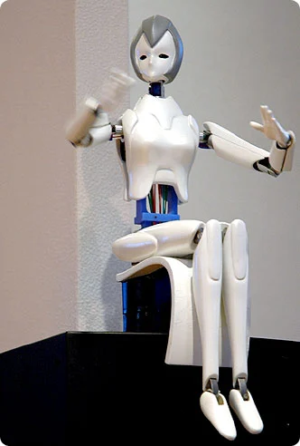 Samsung created a robot doll called April in 2003 but its servos were too big to fit inside its body, so they ran wires through the limbs to an external servo hub