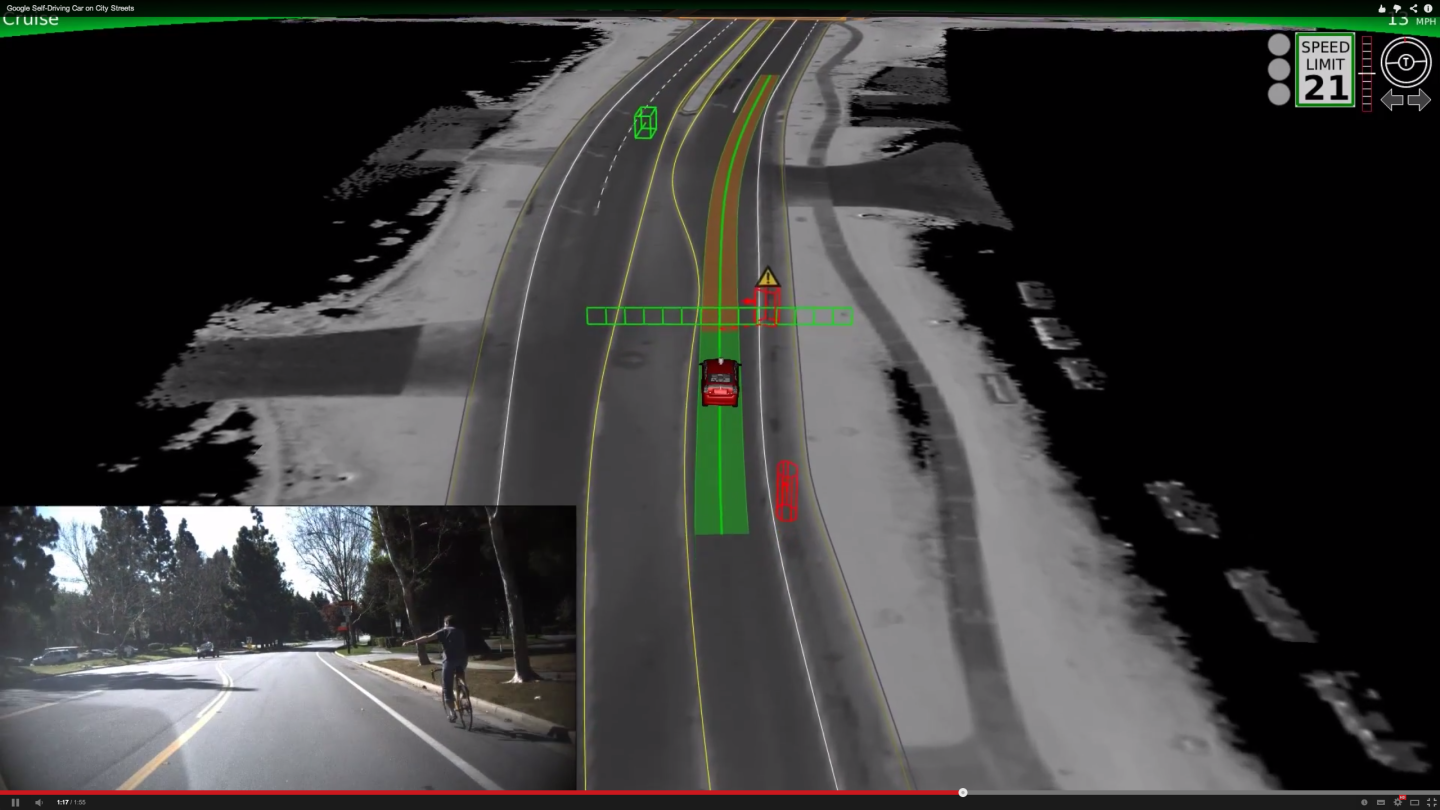 Google's self driving car waits for a cyclist who is making a hand signal