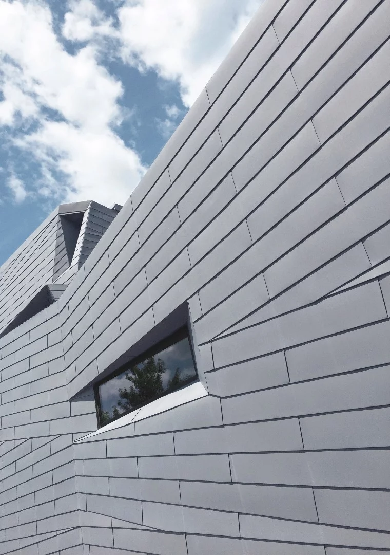 The zinc cladding is designed to reflect the surrounding granite landscape