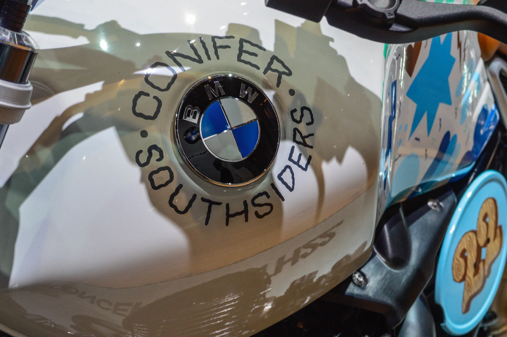 Ornamental Conifer signed his artwork around the renowned emblem. Southsiders Motorcycle Club are the organizers of the Wheels and Waves meeting