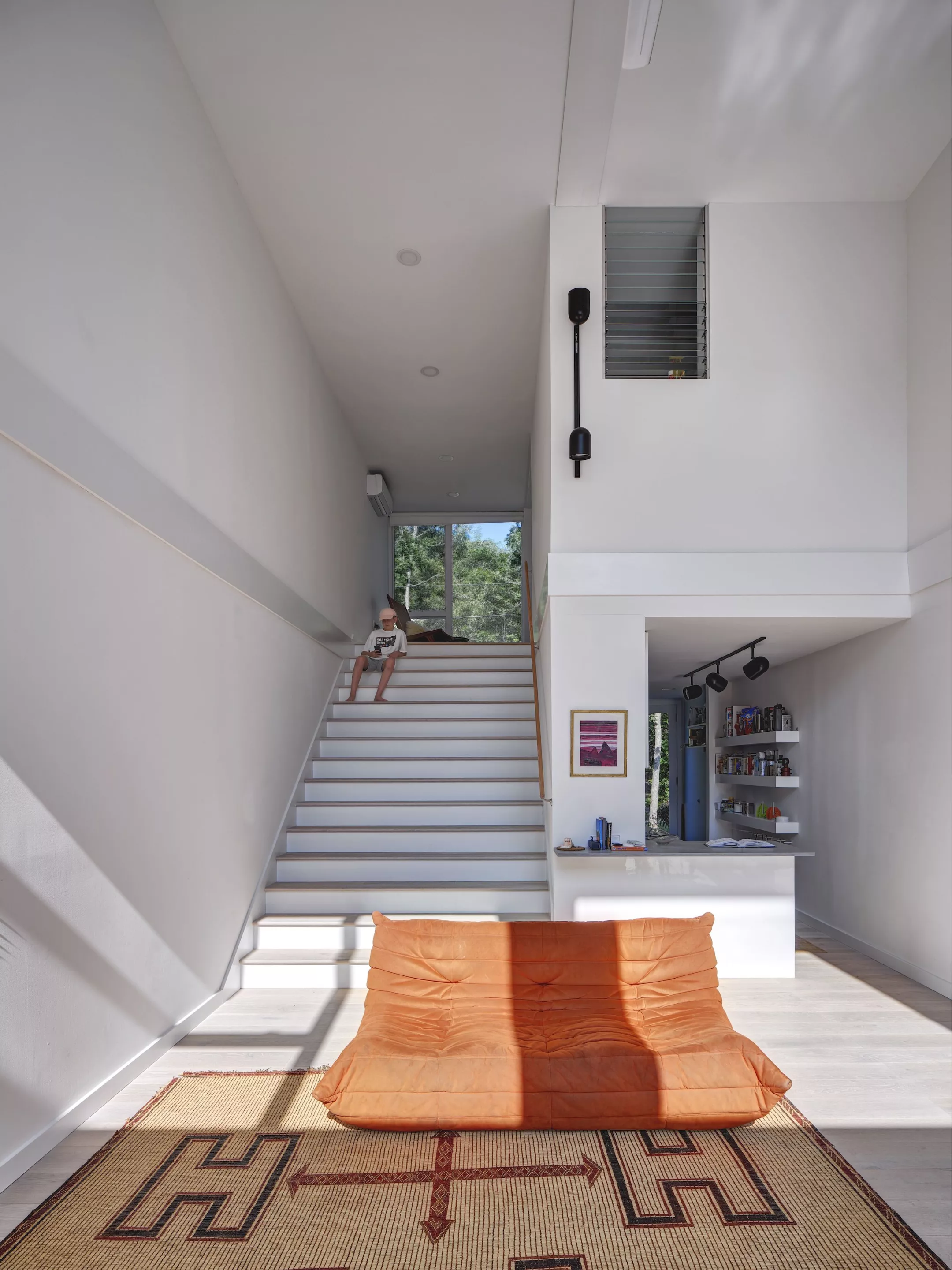 Amagansett Modular's large staircase is envisioned as a place for the family to hang out