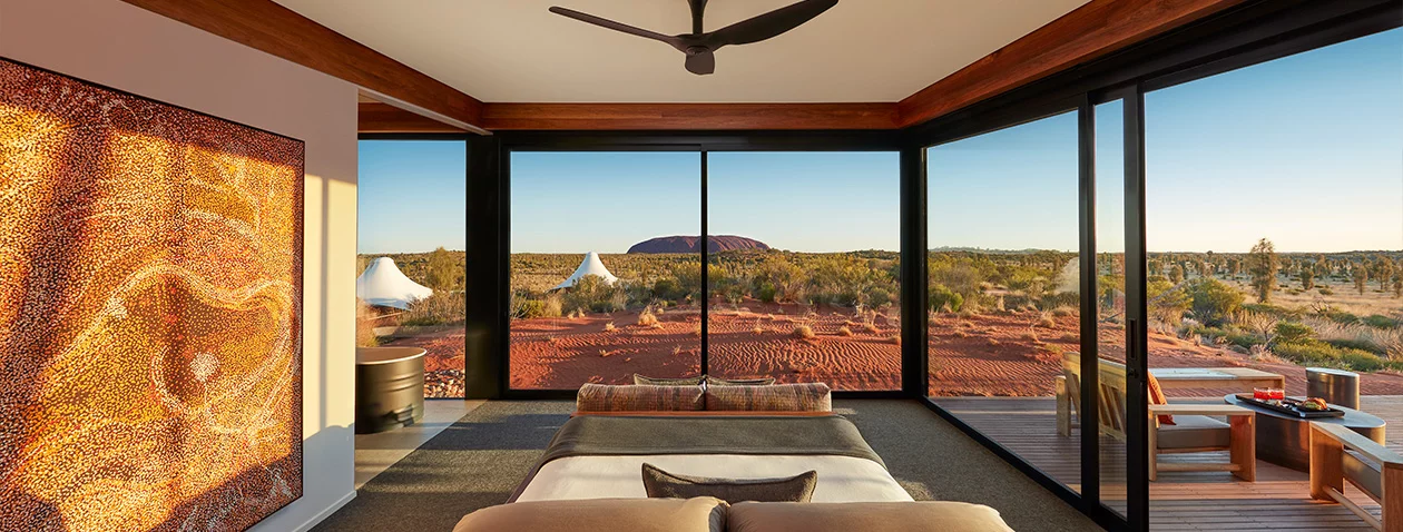 In the center of Australia you’ll find the gigantic and iconic Uluru, and facing it is a luxury hotel called Longitude 131. For those inclined you can helicopter from the local airport to the hotel