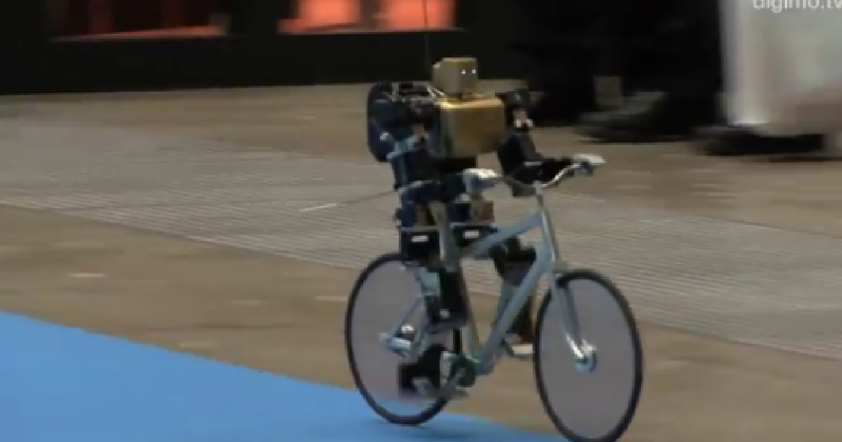 Miniature robot rides bicycle like a pro