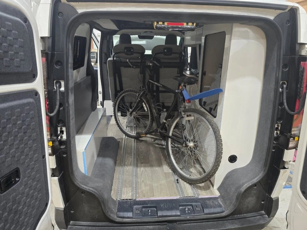 The Schnierle rail-mounted seating system gives the Wellhouse iCamper more versatility than most