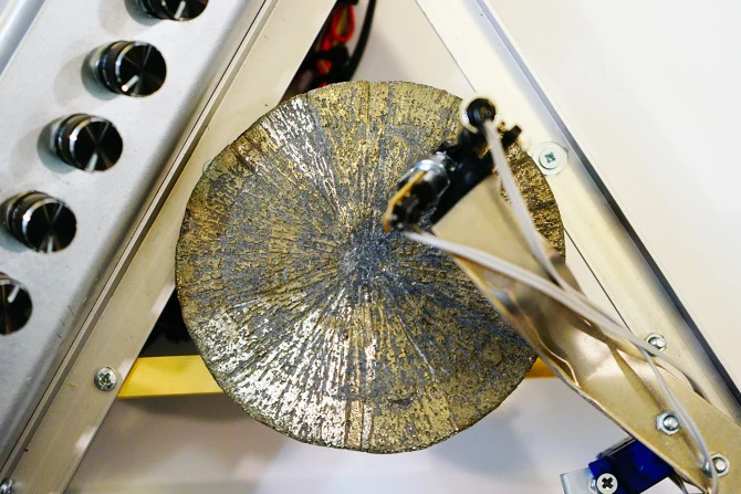 The surface irregularities on the pyrite disc are transformed into synthesized sounds