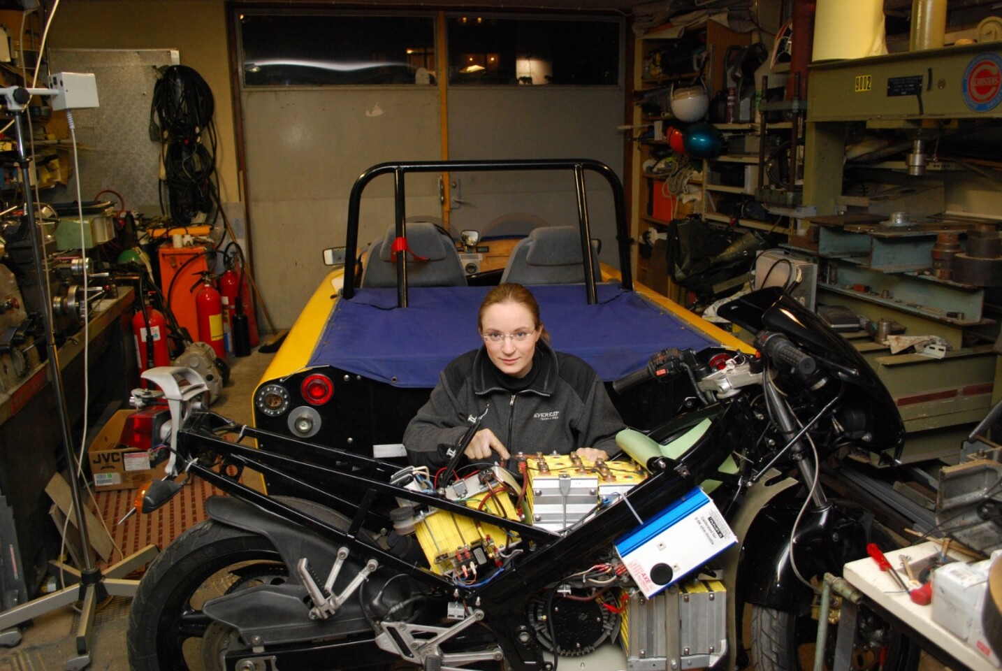 A young Eva working on the ElectroCat - her first electric motorcycle