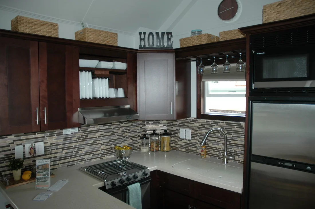 The kitchen also includes a refrigerator that operates off propane and electric