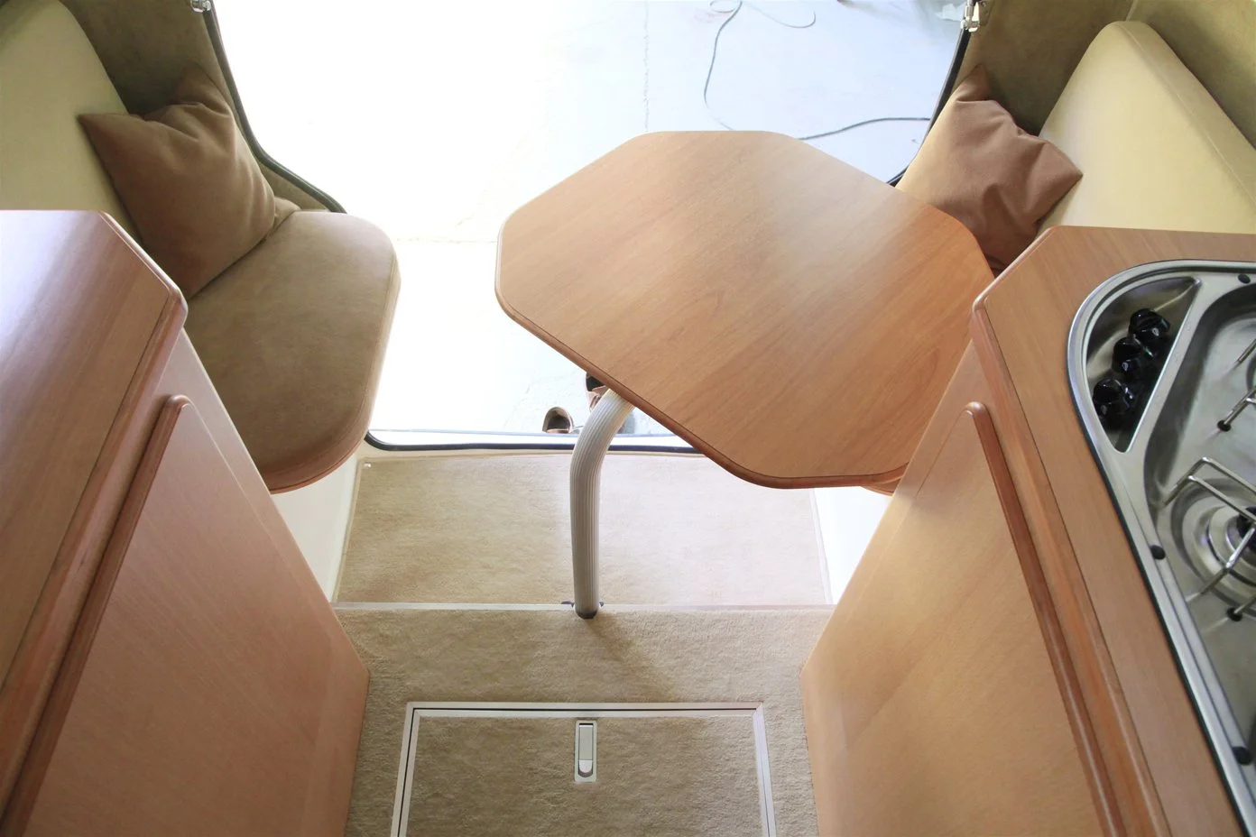The dining room table adjusts so that you can get around it