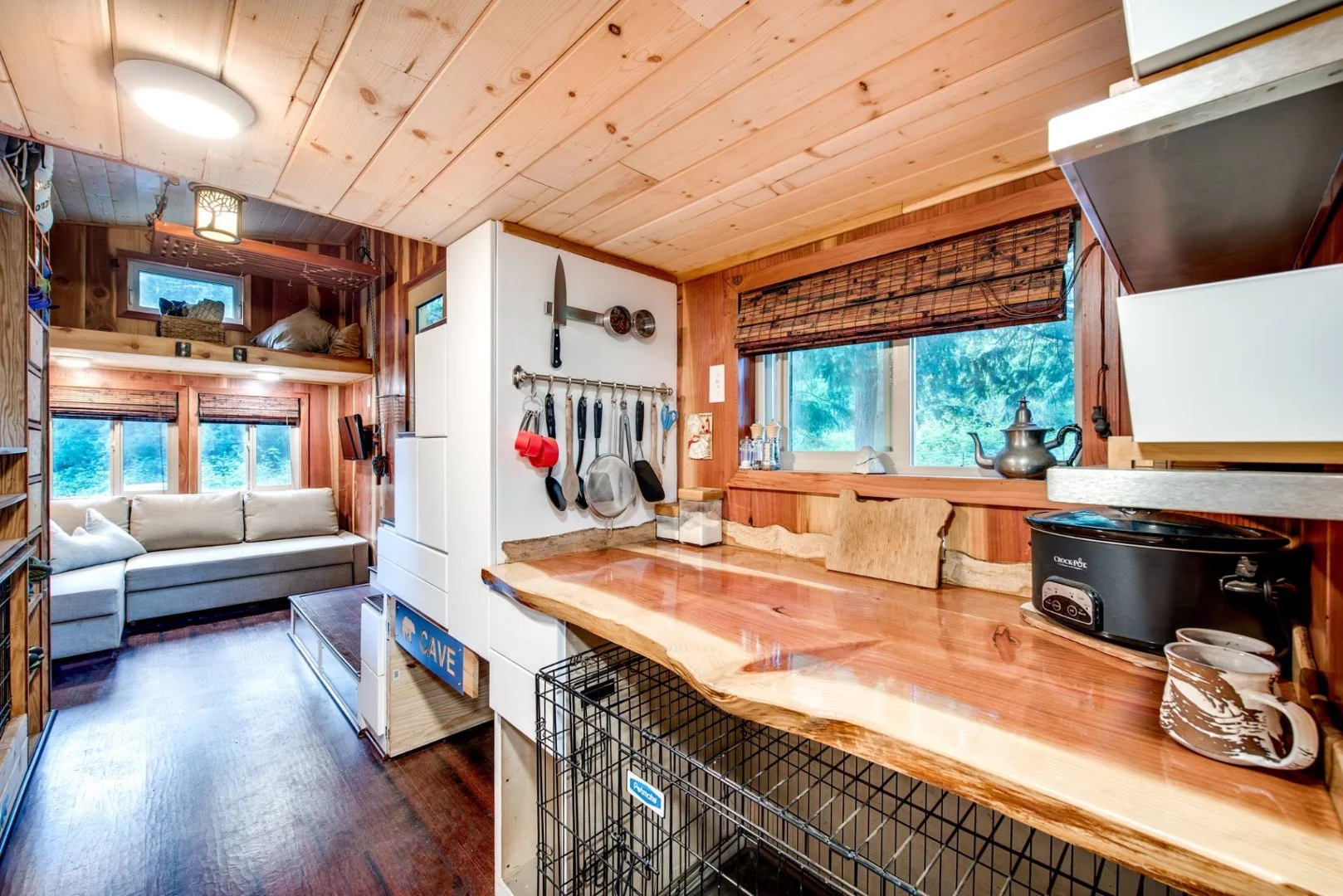 The tiny home includes plenty of dog related items, including kennel space and toys