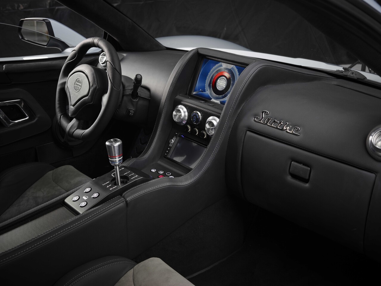 Sarthe interior features carbon fiber dashboard, brushed aluminum vents, leather steering wheel and a customizable Central Info System (CIS)