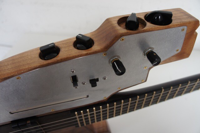 WAB installed a battery-powered Z-Vex Wooly Mammoth distortion circuit in the kitar's solid body, with knobs for controlling the level of distortion, compression, tone and volume