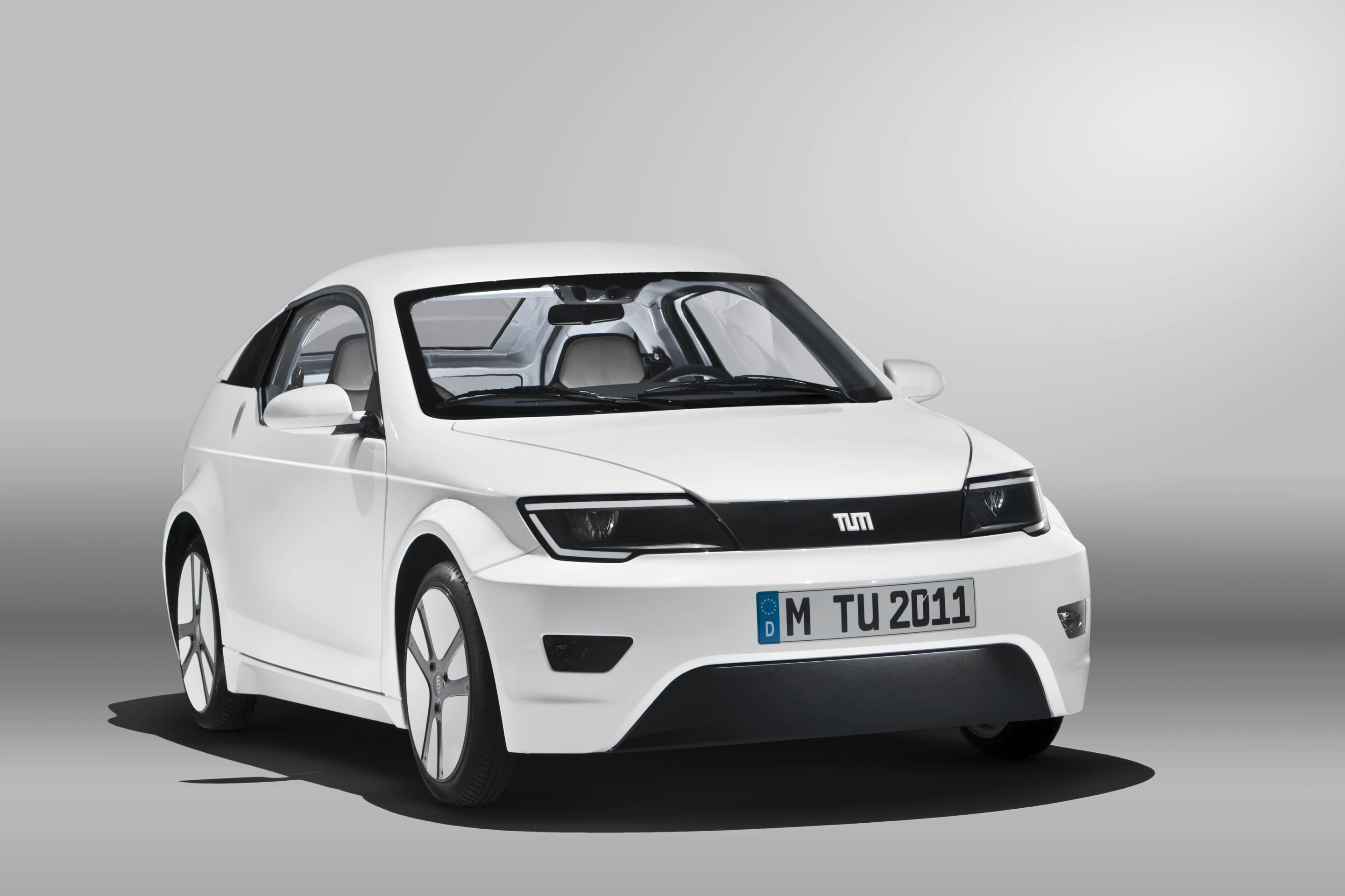 The sporty two seater electric coupe features a lightweight aluminum frame and carbon fiber reinforced plastic chassis