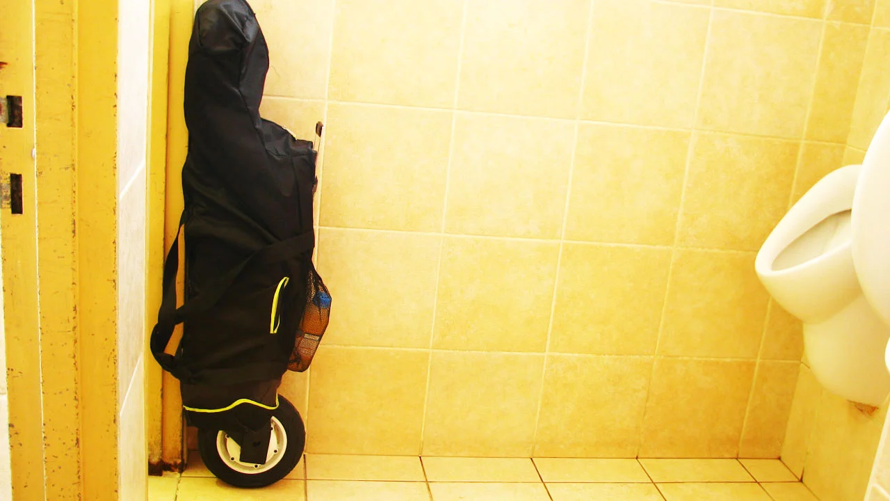 The MyWay Quick, folded and wrapped in its carry bag, can be wheeled alongside you