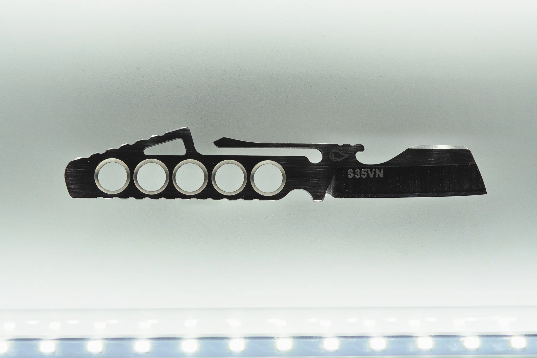 The knife has punch-outs in the handle to keep things light