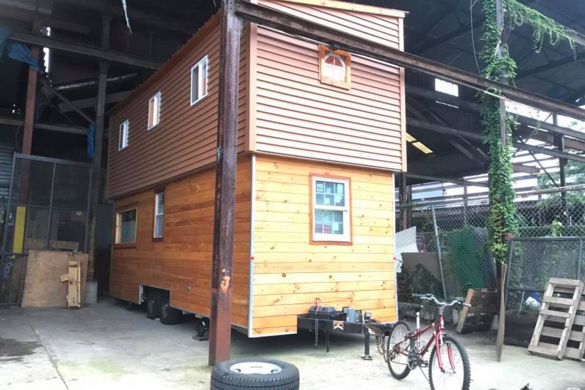 This tiny house raises the roof literally
