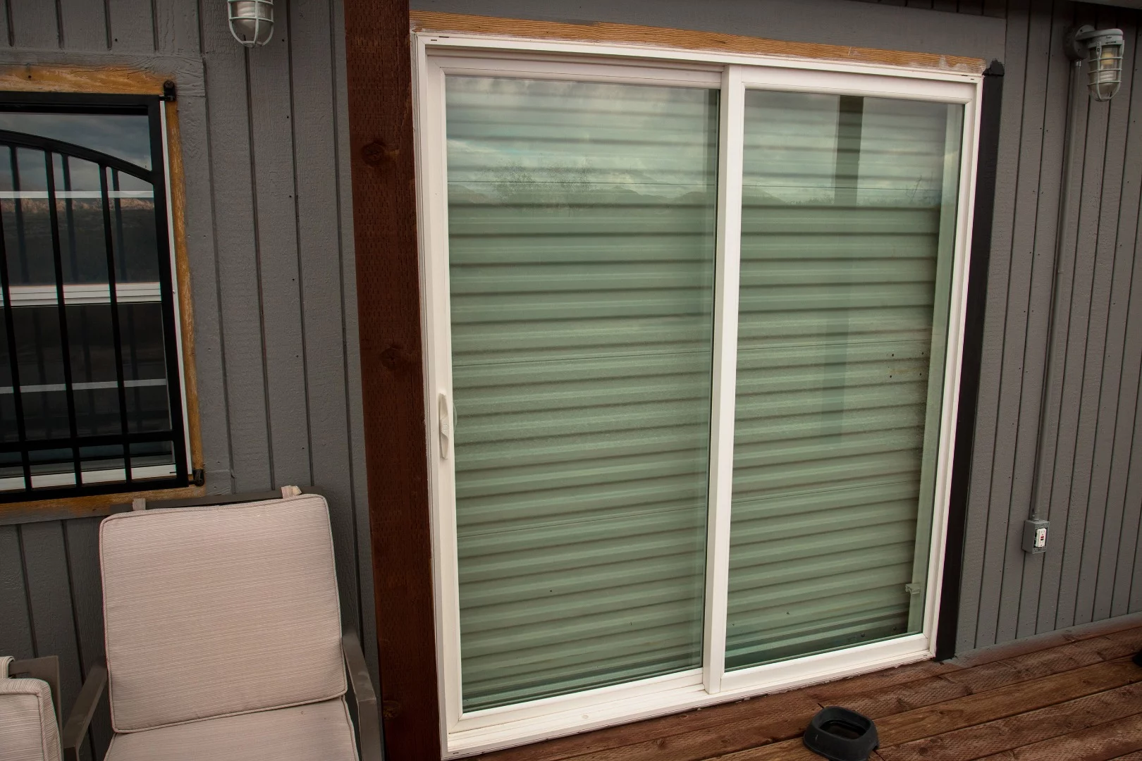 Being remote and not exactly having neighbors, security can be an issue. The front sliding glass door of his tiny home has a security roll up door.