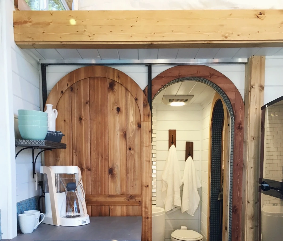 Closer view towards the Tiny Adventure Home's bathroom from the kitchen