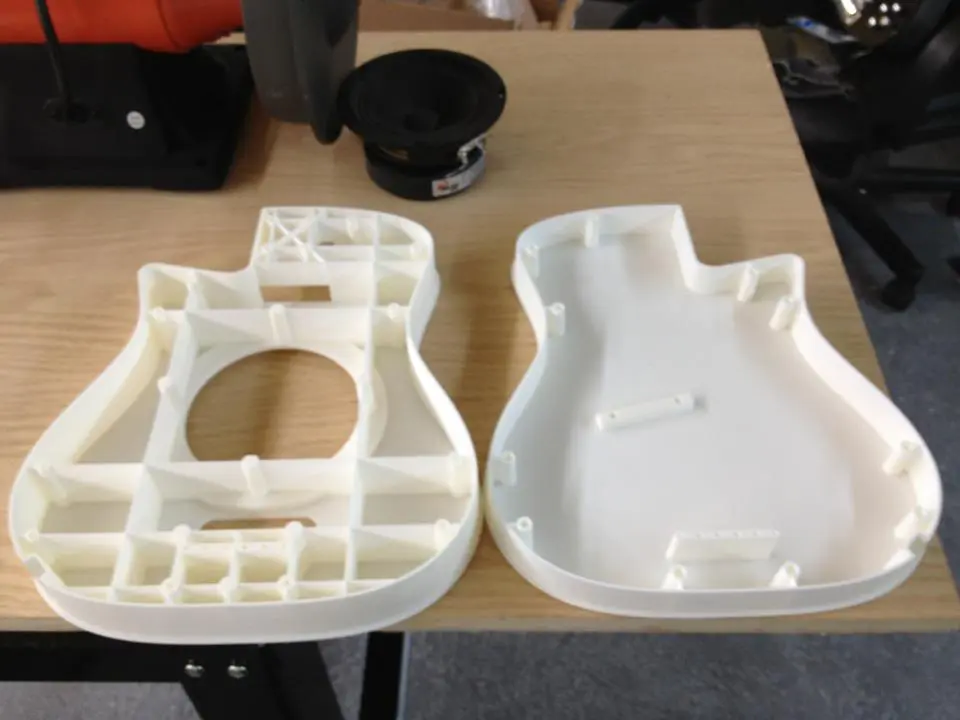 Front and back section in polycarb, and the speaker driver to the top of the picture that's responsible for the instrument's thickness