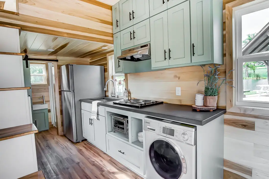 The Clover's kitchen features custom cabinetry