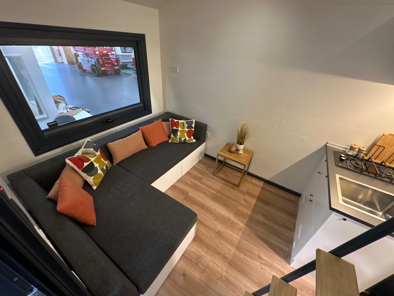 The Mo.5 450's living room is snug and includes an L-shaped sofa bed that sleeps two