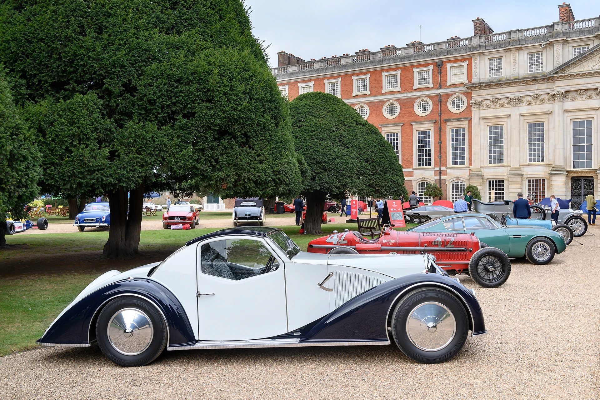 The 2021 Concours of Elegance presented by A. Lange & Söhne was held at Hampton Court Palace with the prestigious "Best in Show" award going to a unique art deco rolling sculpture known as the Voisin C-27 Aérosport of Merle and Peter Mullin. The Mullins have a collection of the finest French cars in the world including some priceless Bugattis, Citroens, Delahayes, Delages, and Peugeots. If you are in California, be sure to check out The Mullin Automotive Museum in Oxnard, California, US. Established in 2010, it displays over 100 vehicles from the collection