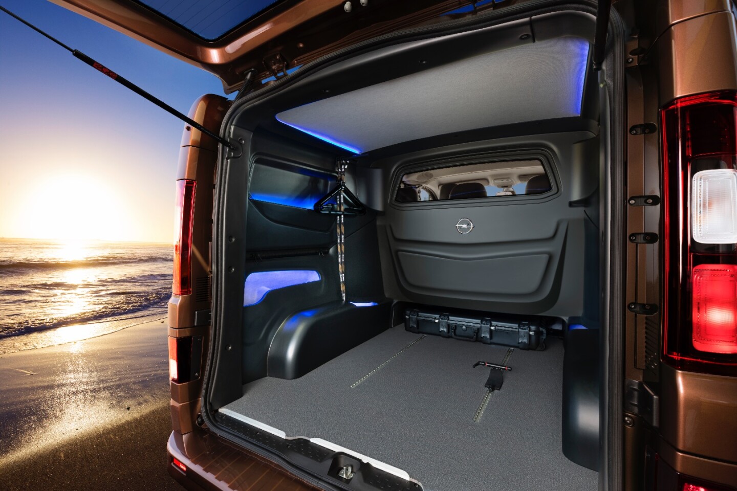 The rear is optimized for cargo hauling and includes integrated tracks