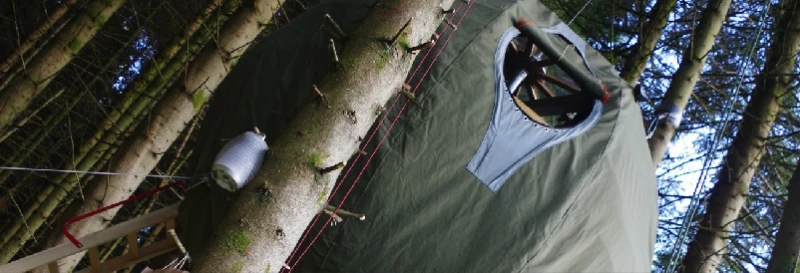 The interior of the Tree Tent can include a water storage tank and pump, underfloor battery pack, and a bio-fuel stove