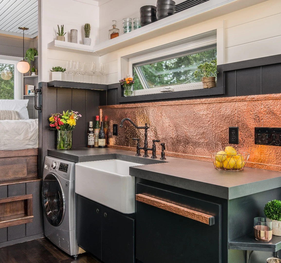 The Escher's kitchen includes a Whirlpool fridge, Wolf cooker and lots of custom storage space